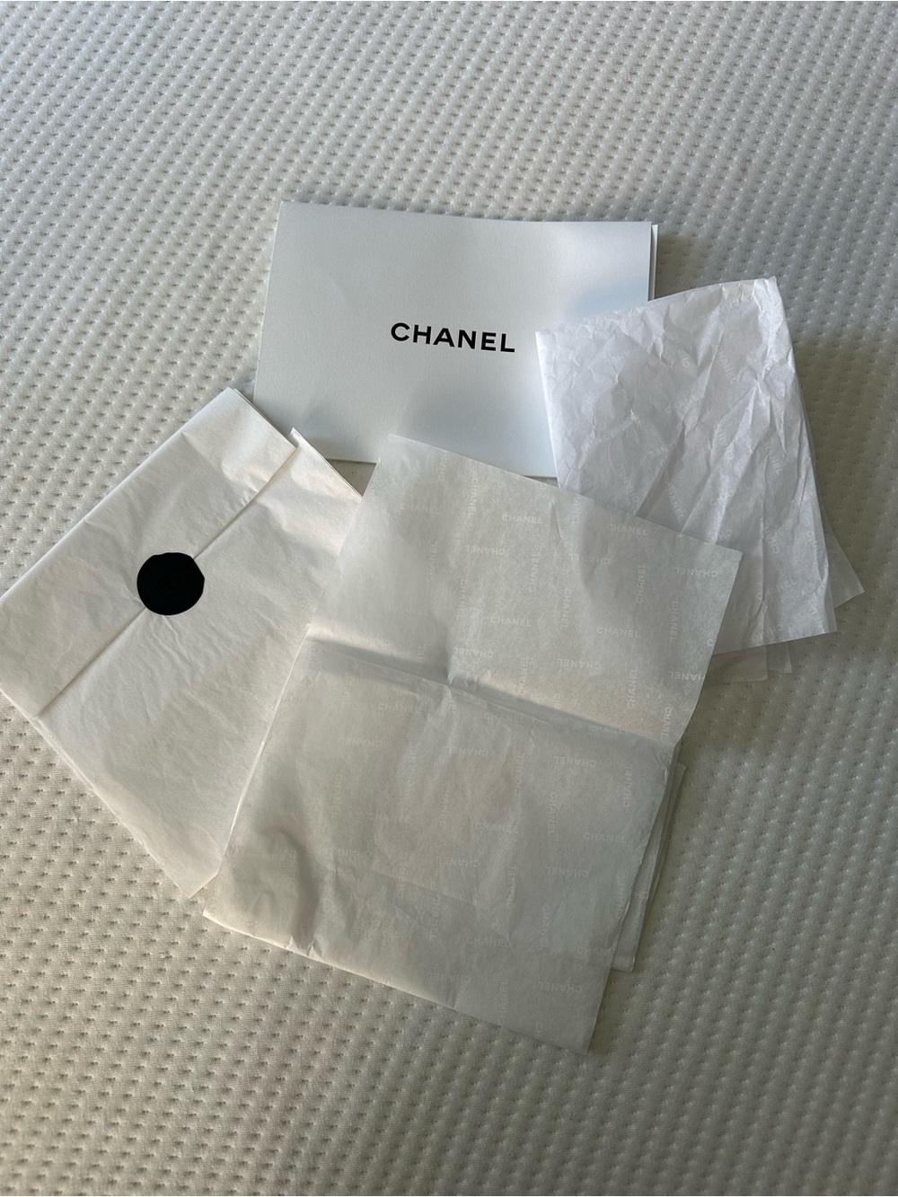 CHANEL Black Wax Seal Sticker on White Branded Tissue